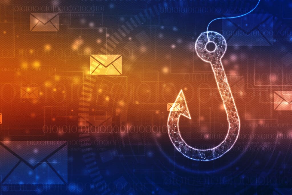 A light colored fish hook against a background of envelopes symbolizing emails.
