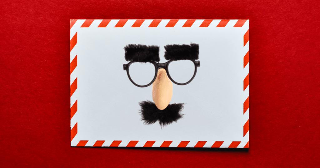 An envelope with a gag disguise including a fake nose, mustache, glasses and eyebrows.
