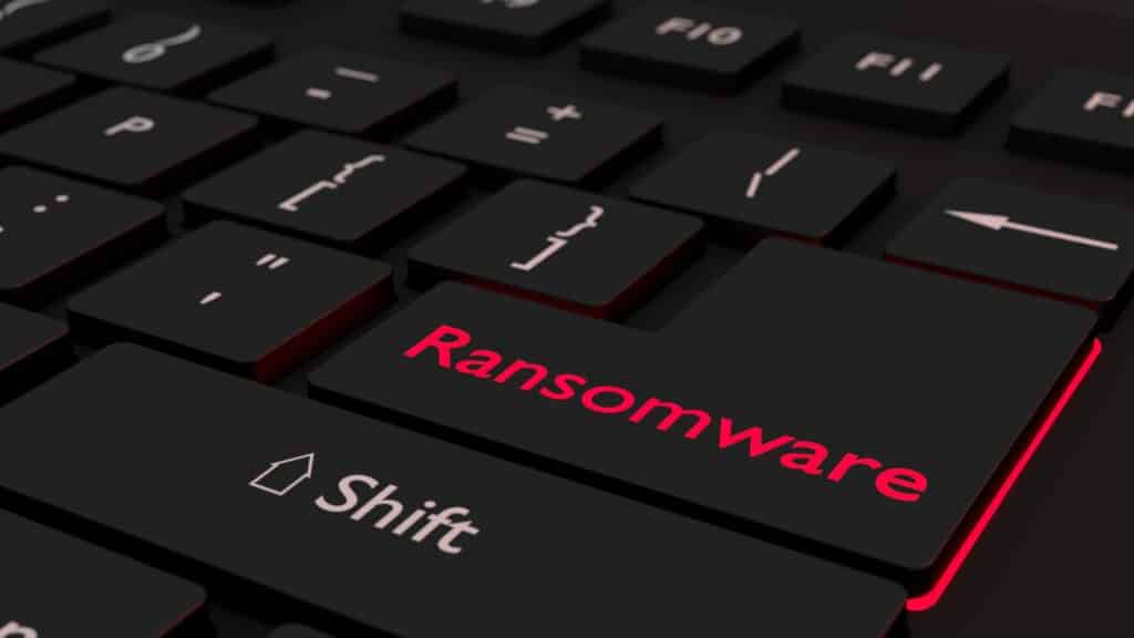 A keyboard whose "enter" key has the word "ransomware" written on it. The word "ransomware" is glowing red.