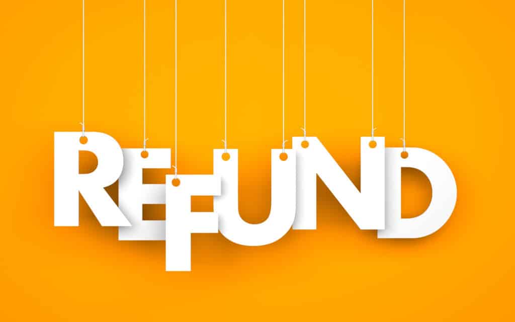 Letters hanging from string that spell out the word "REFUND."